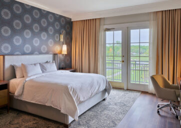 A lakeview King bedroom at the Inn at Meadowbrook offers just the right amount of luxury near Kansas City