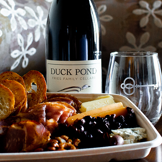 Our sunset and savory package includes a bottle of house wine, charcuterie assortment, and plenty of atmosphere.